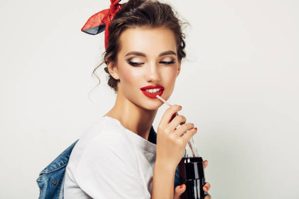 Beautiful woman drinking soda