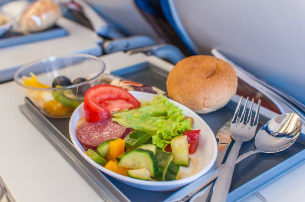 Food on board of an airplane Food on board of an airplane light mea stock pictures, royalty-free photos & images