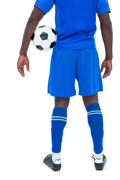 istock Football player in blue holding ball 843428080