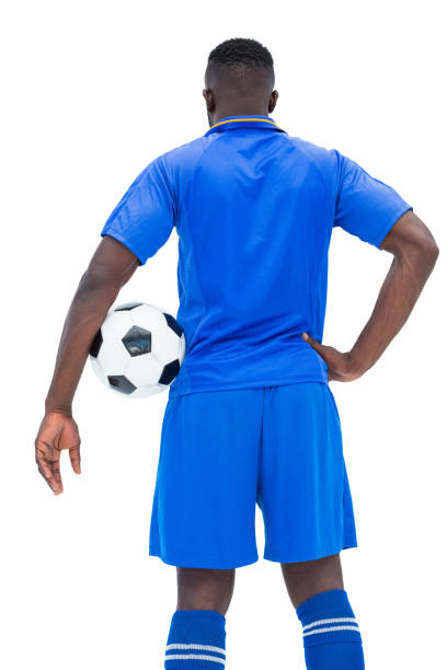istock Football player in blue holding ball 843428126