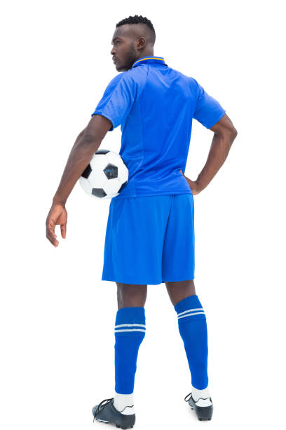 istock Football player in blue holding ball 843428192