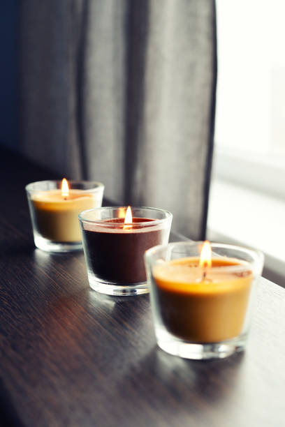istock Cosy candles on an wooden table 843428468
