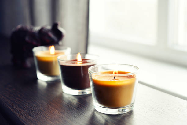 istock Cosy candles on an wooden table 843428470