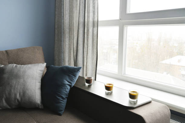 istock Clean family room with brown couch 843428568