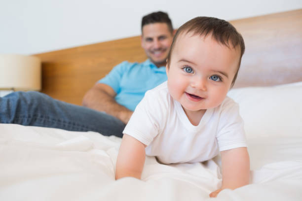 istock Adorable baby boy on bed 843441224