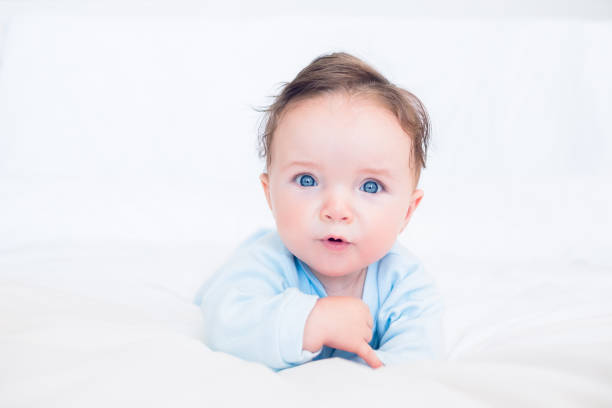 istock Innocent baby with blue eyes 843441688