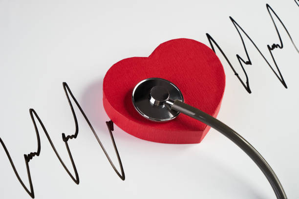 Medical stethoscope and red heart with cardiogram isolated on white. Cardiac therapeutics assistance, pulse beat measure document, arrhythmia pacemaker medical healthcare concept