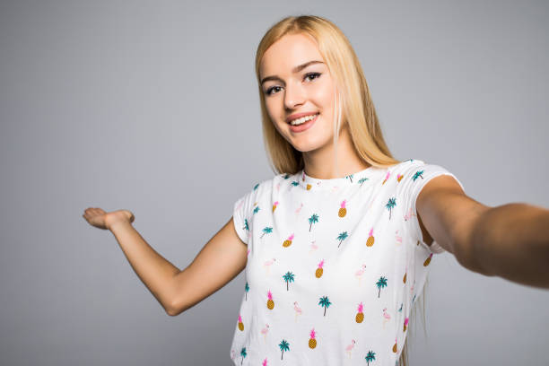 istock Happy cute woman making selfie over gray background. 843445168