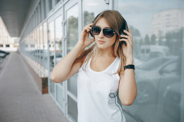 istock blonde with headphones 843445834
