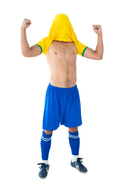 istock Happy football player in yellow celebrating 843446036
