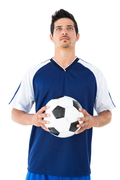 istock Football player in blue holding the ball 843446076