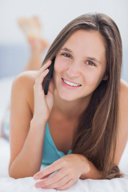 istock Smiling woman in bed 843448364
