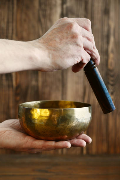 istock Male hand playing on Tibetan handcrafted singing bowls 843451754