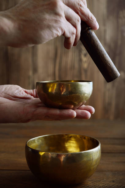 istock Male hand playing on Tibetan handcrafted singing bowls 843451776