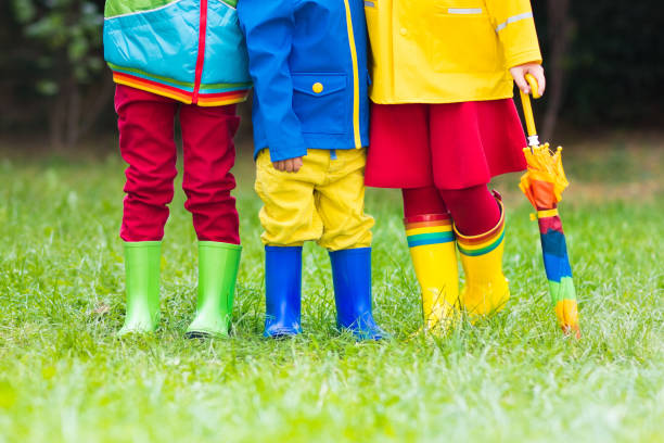 istock Kids in rain boots. Rubber boots for children. 843452174