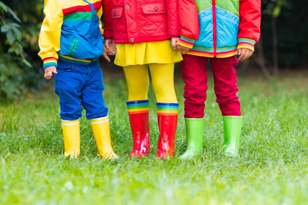 istock Kids in rain boots. Rubber boots for children. 843452354