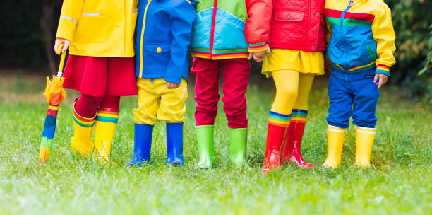 istock Kids in rain boots. Rubber boots for children. 843452958