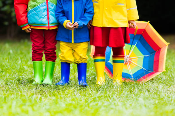 istock Kids in rain boots. Rubber boots for children. 843455110