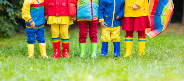 istock Kids in rain boots. Rubber boots for children. 843455152