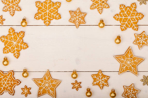 istock christmas homemade gingerbread cookies on wooden table, top view, copy space, frame 843455414