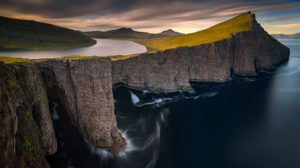 Sorvagsvatn lake Sorvagsvatn lake on cliffs of Vagar island in sunset, Faroe Islands vágar photos stock pictures, royalty-free photos & images