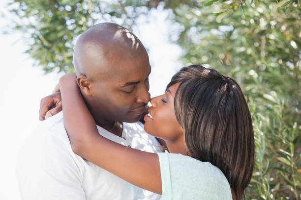 istock Attractive couple embracing in their garden 843459794