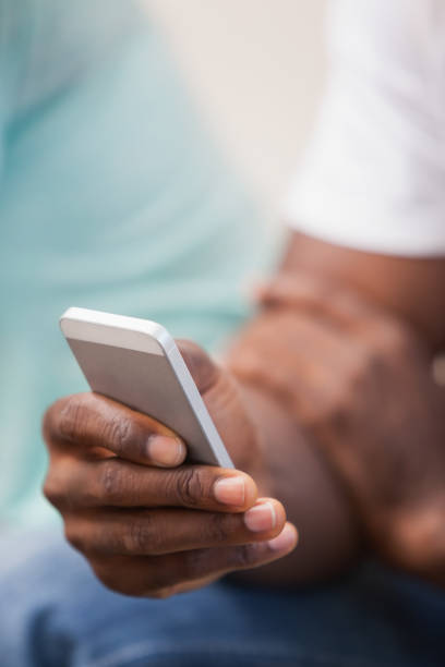 istock Man holding smartphone in hand 843459850