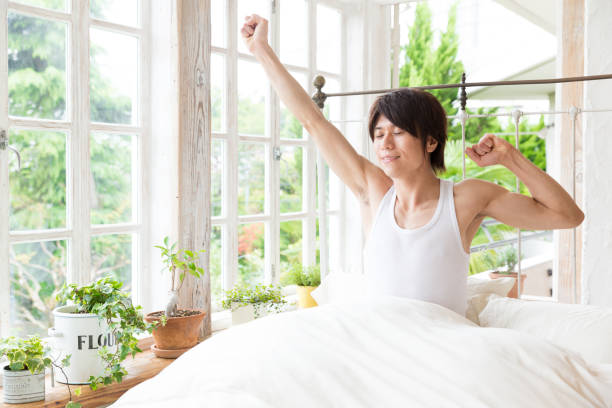 istock young asian man in bedroom 843463050