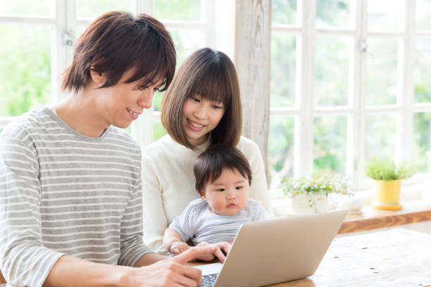 istock young asian family using laptop 843463098
