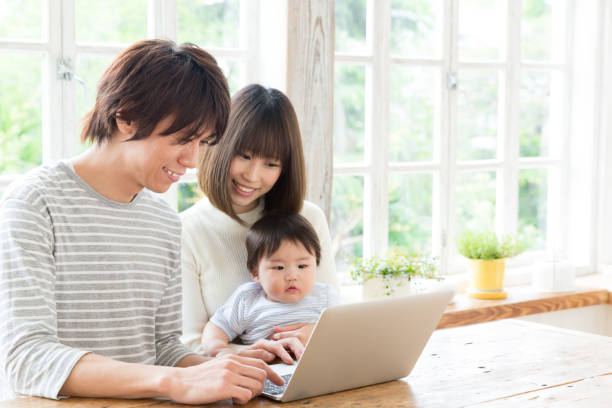 istock young asian family using laptop 843463100