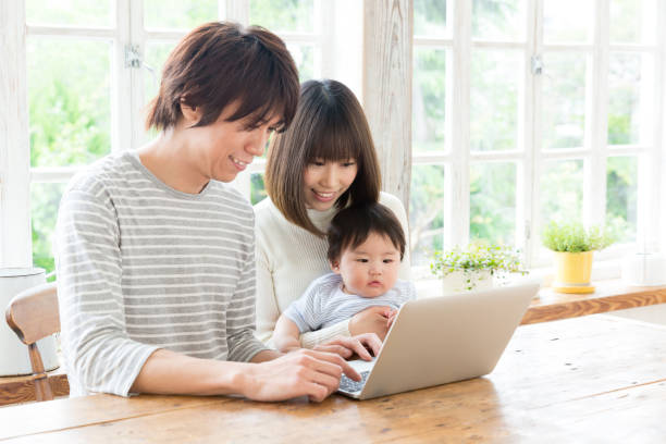 istock young asian family using laptop 843463112