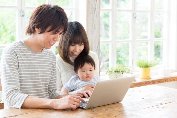 istock young asian family using laptop 843463118