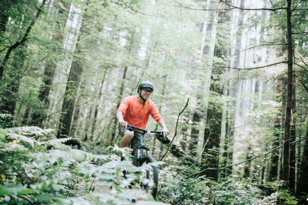istock Mature Man Mountain Biking in Forest 843466786