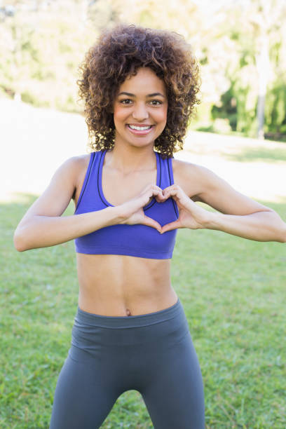 istock Sporty woman showing heart shape 843469088