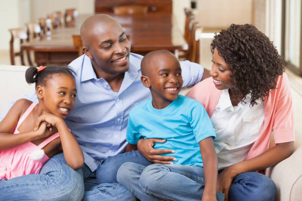 istock Family relaxing together on the sofa 843474128