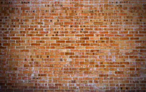 istock Texture of old red brick wall surface with cement and concrete seams 843476492