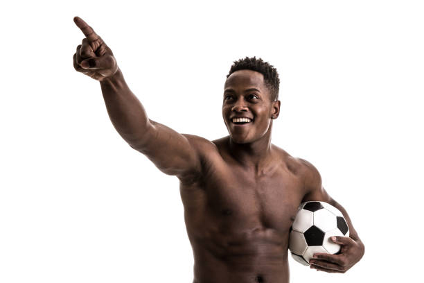 istock Afro young man celebrating with soccer ball 843478444