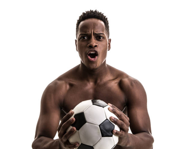 istock Afro young man celebrating with soccer ball 843478458