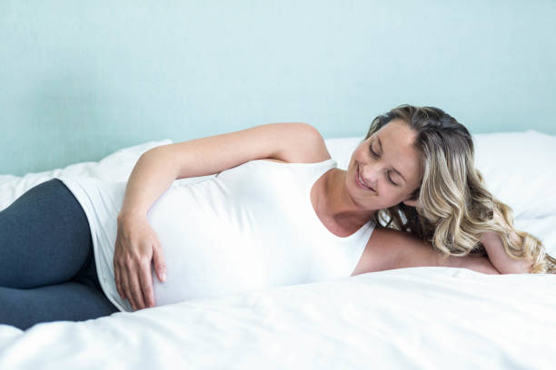 istock Pregnant woman touching her belly 843484006