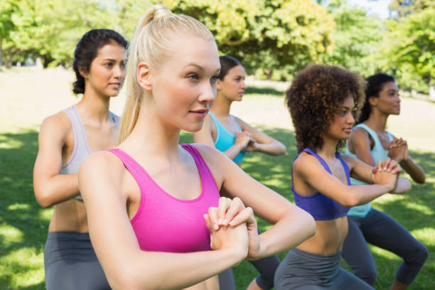 istock dedicated women exercising in park 843484356