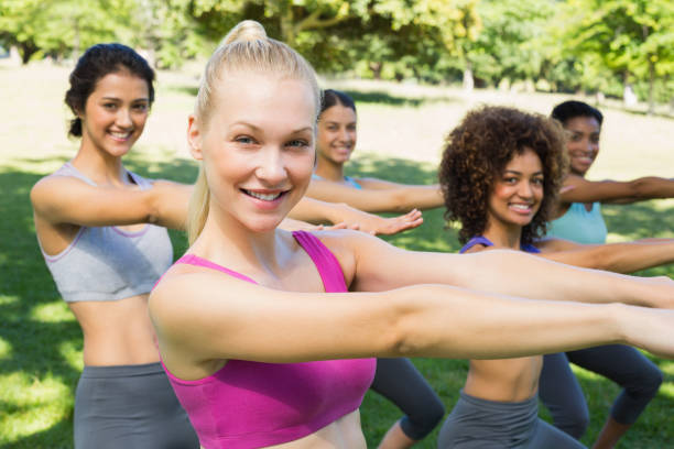 istock Multiethnic women stretching in park 843484378