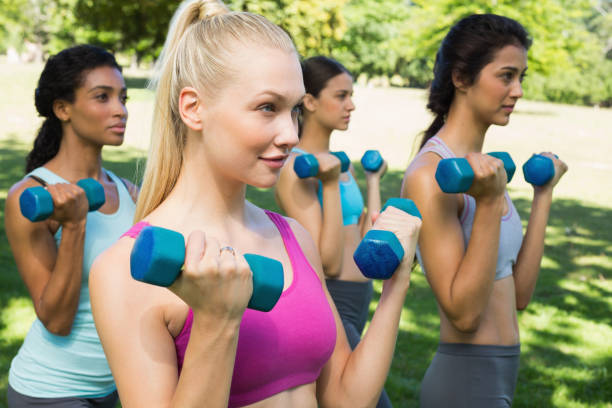 istock Dedicated women lifting free weights 843484444