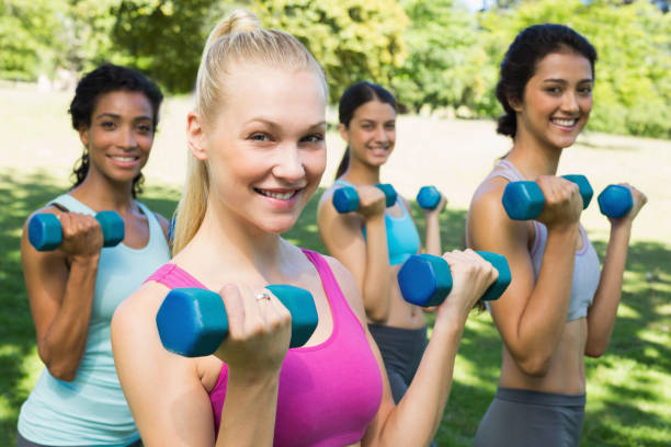 istock Multiethnic sporty women weightlifting 843484456