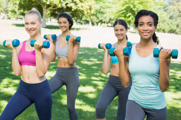 istock Confident sporty women lifting weights 843484486