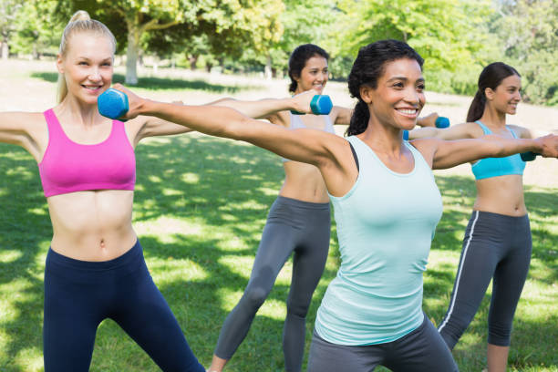 istock Sporty women lifting hands weights 843484526