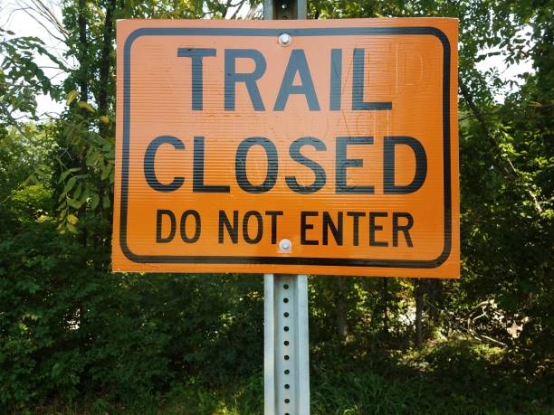 istock orange trail closed do not enter sign 843484936