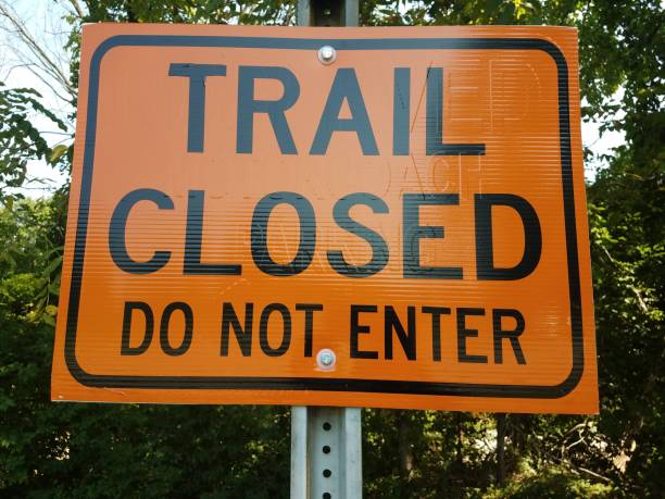 istock orange trail closed do not enter sign 843484946
