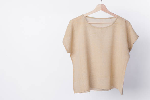 istock cotton beige plain woman blouse on white background. 843491192