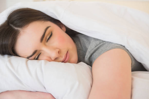 istock Calm girl sleeping in her bed 843491380
