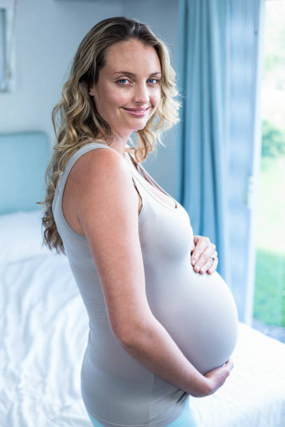 istock Pregnant woman touching her belly 843494884